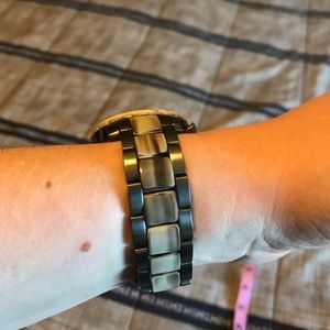 Fossil marble colored brown tan. One of them is chipped excellent working watch.